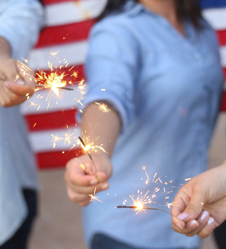 People Holding Lit Sparklers People Holding Lit Sparklers